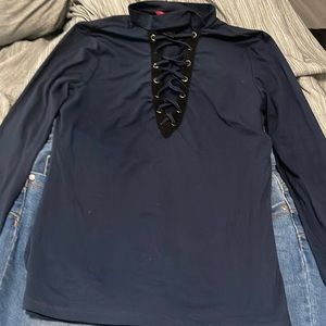 A blue stretchy sleeve shirt with cleavage holes to bring out a more sexy look